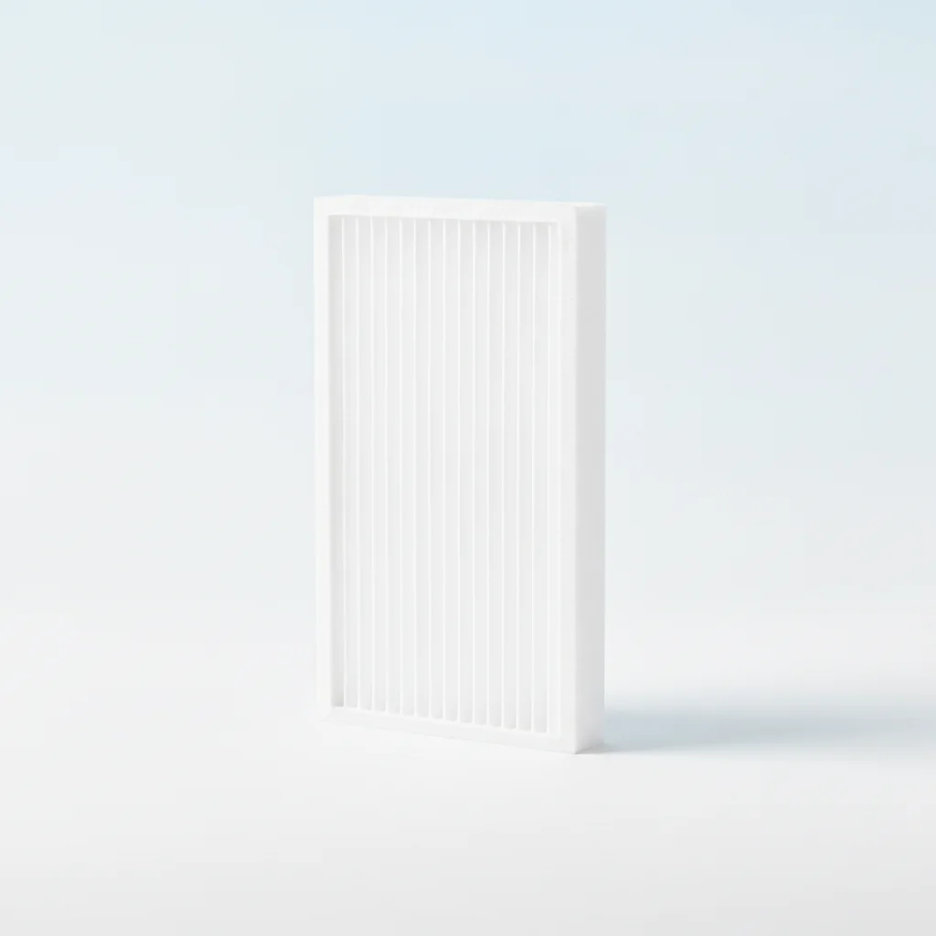 White pleated HVAC air filter standing upright