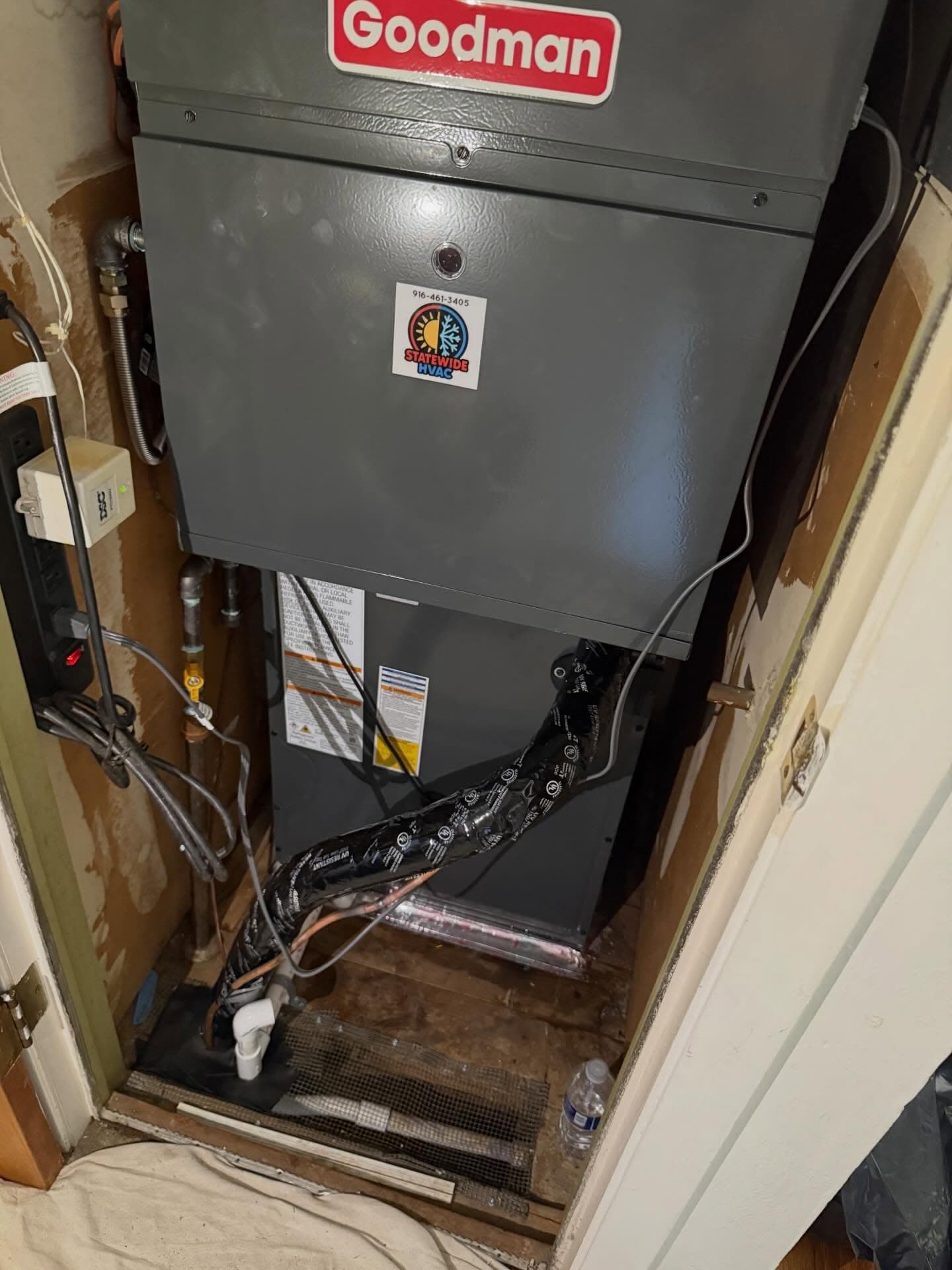New residential furnace and AC condenser after full system replacement.