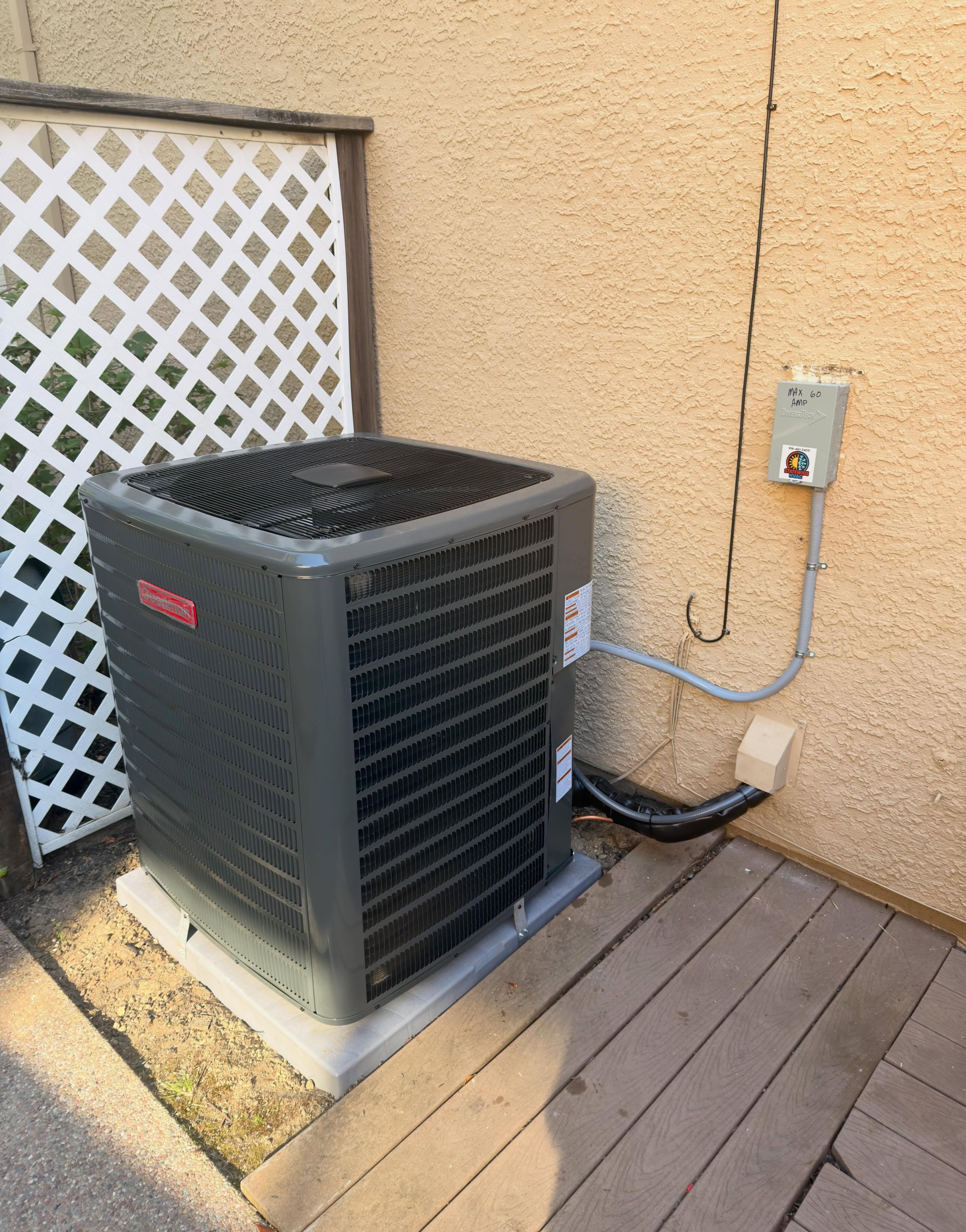 New 5-ton Goodman HVAC system replacing an older R-22 unit.