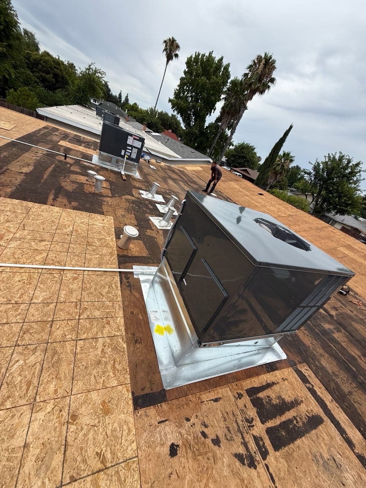 Duplex upgraded from natural gas HVAC to all-electric heat pumps.