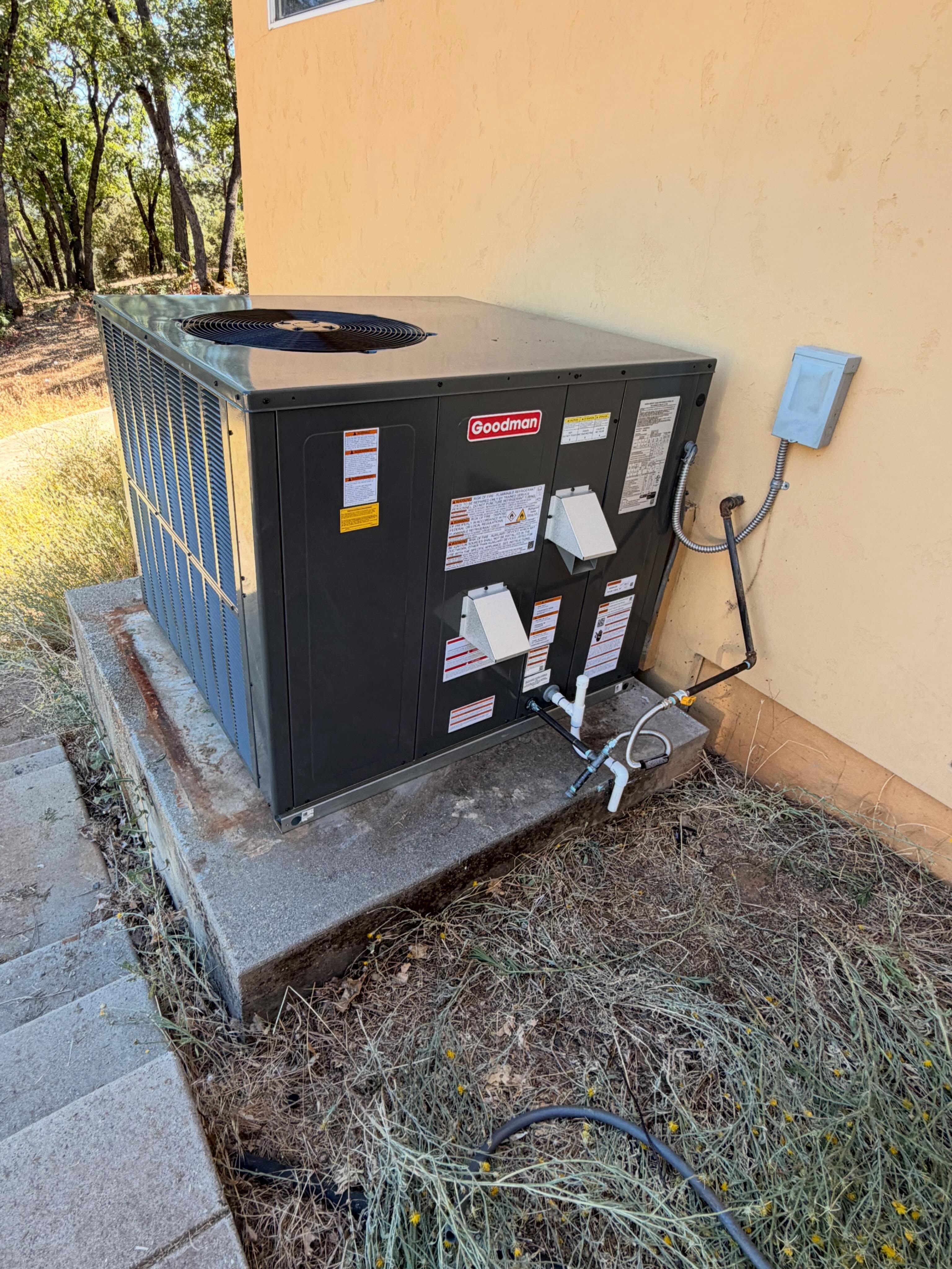 New Goodman gas/electric package unit replacing an older rooftop system.